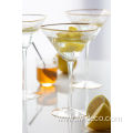 organic cocktail martini glass with gold rim